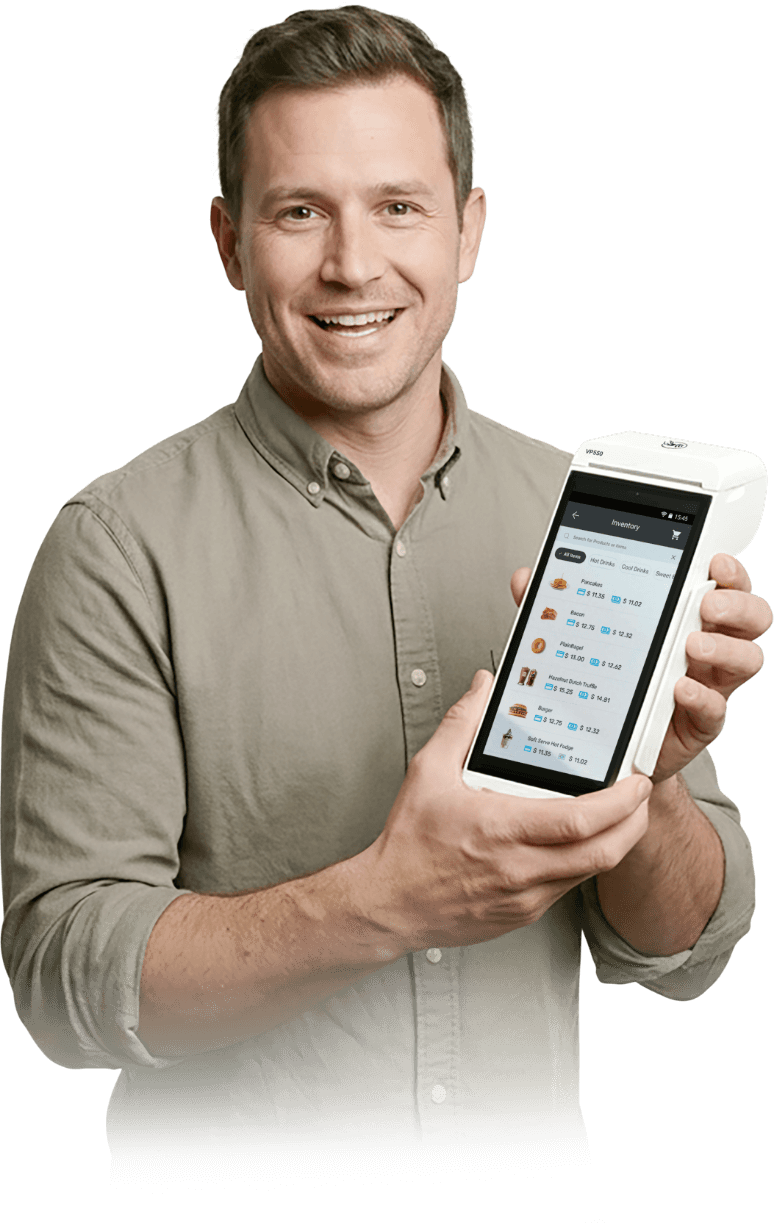 Male merchant using Valor PayTech POS system at checkout